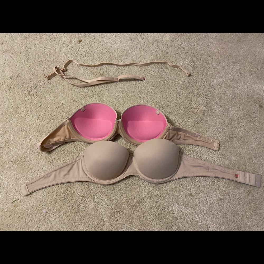 Two pink strapless bras
